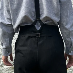 High waist trouser in black wool with very fine stripe, button fly and brace buttons - all sizes